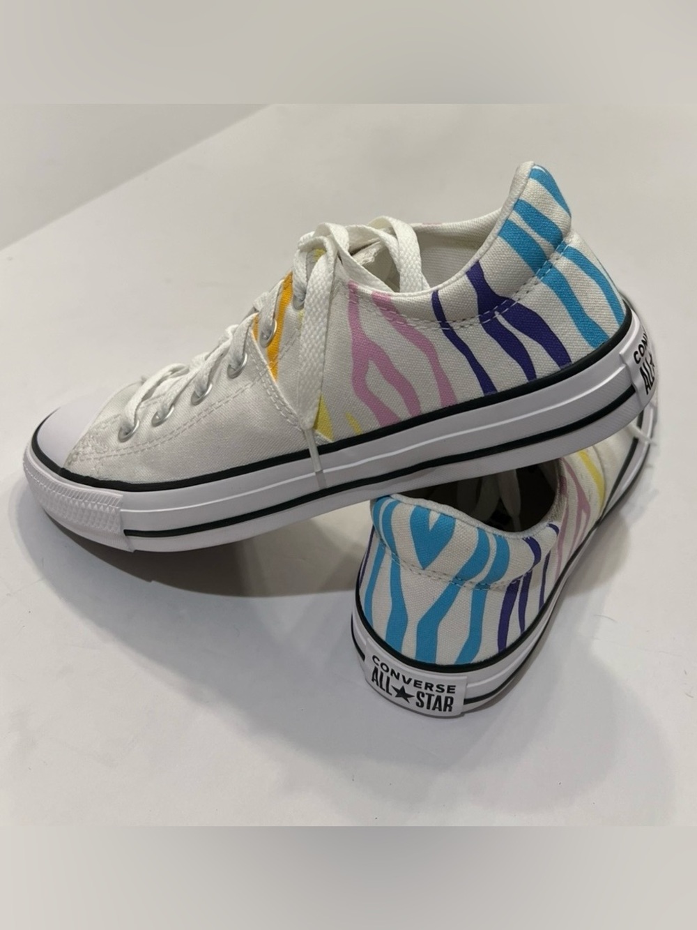 Converse Wome Low Top Sneakers in White with Blue, Purple, Pink, Yellow Stripes